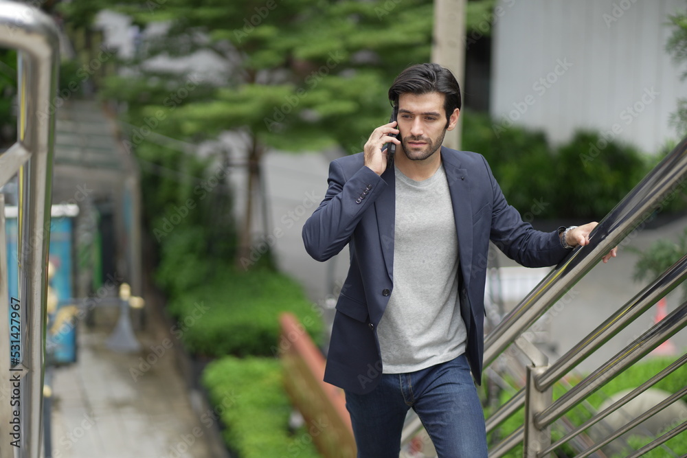 Young Caucasian businessman on smart phone Young Caucasian businessman on smart phone