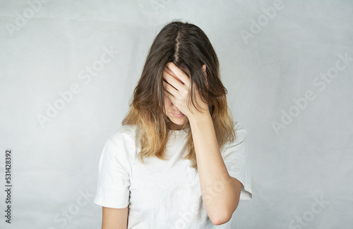Fotografija Sad young woman with a pensive and irritated face