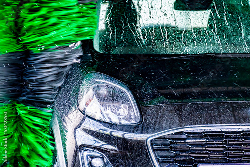 A vehicle in an automatic car wash photo