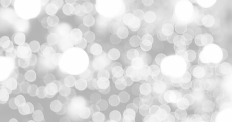 Blurred background silver glitter shiny sparkling banner. Happy Holidays background for white template on christmas card brochure. Silver bokeh template for digital presentation slideshow background