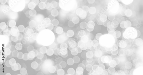 Blurred background silver glitter shiny sparkling banner. Happy Holidays background for white template on christmas card brochure. Silver bokeh template for digital presentation slideshow background