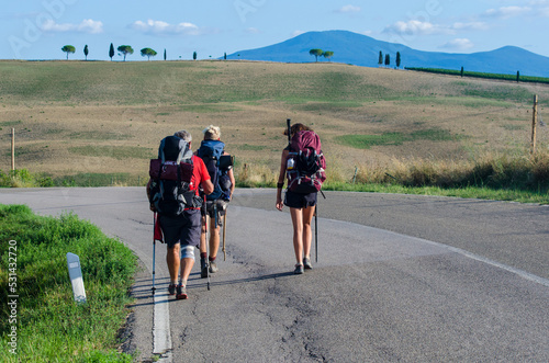 Tre Pellegrini in cammino lungo la Via Francigena in Valdorcia in Toscana photo