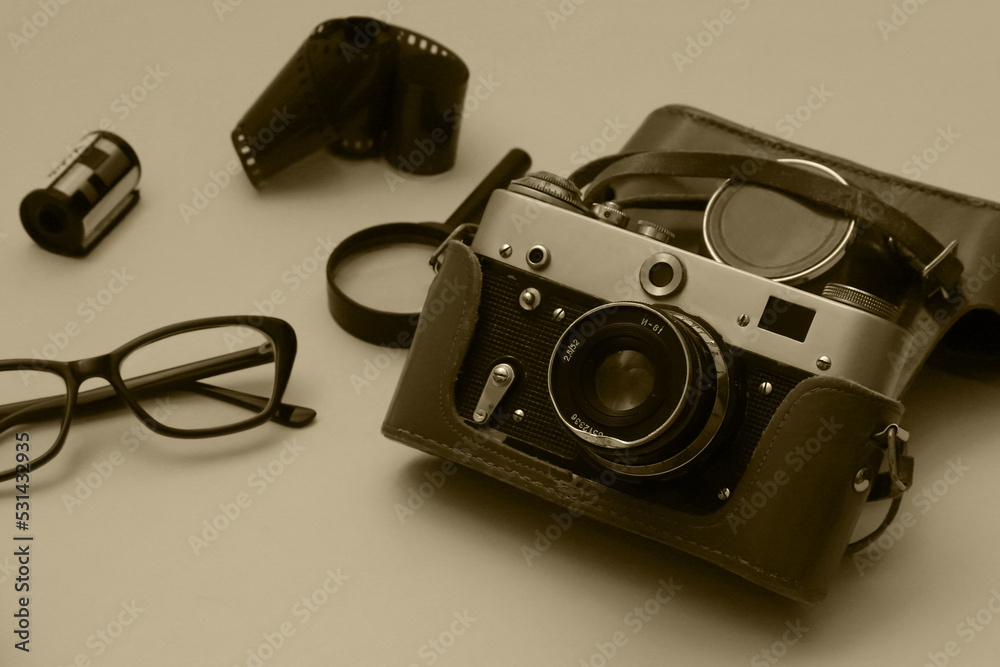 Old film camera with accessories and glasses with diopters