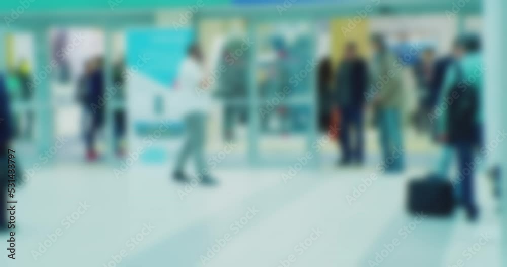 business life.blurred silhouettes of many unrecognizable people inside a modern building.modern urban environment.blurred background. business life.blurred silhouettes of many unrecognizable people inside a modern building.modern urban environment.blurred background.