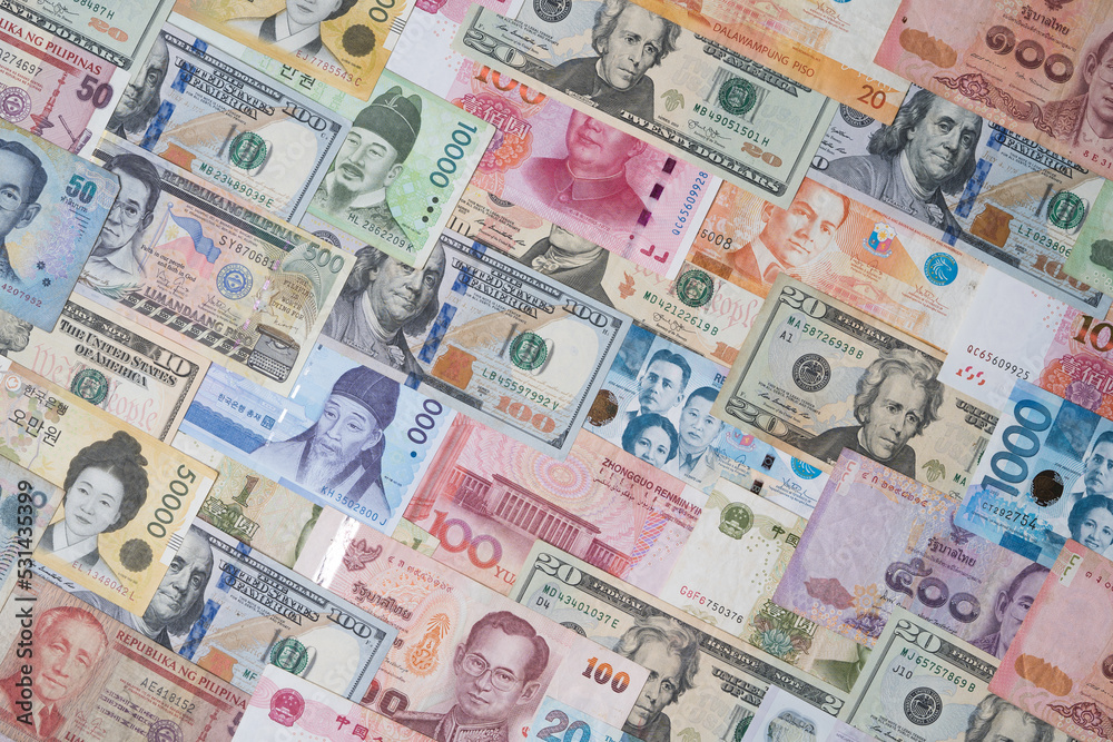 Top view of Various of international banknote include dollar Yuan Won Baht Peso for currency exchange and money transfer concept. Top view of Various of international banknote include dollar Yuan Won Baht Peso for currency exchange and money transfer concept.