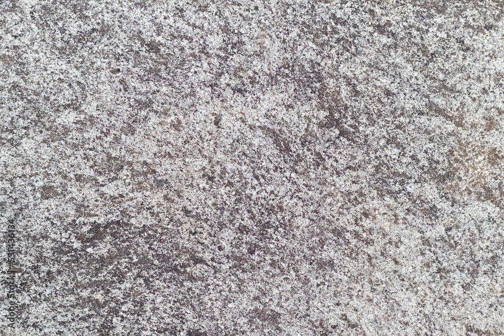 Texture of a stone wall with cracks and scratches which can be used as a backgr. The texture of the stone. Texture of a stone wall with cracks and scratches which can be used as a backgr. The texture of the stone.
