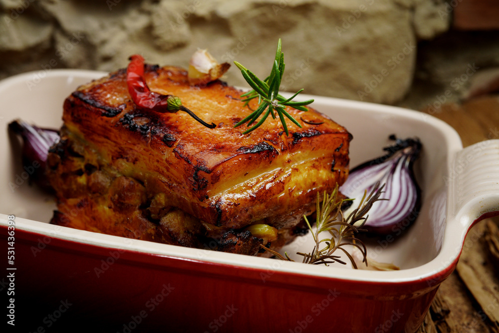 Roasted pork with garlic and turmeric. Beautiful background, homemade food, rustic. Roasted pork with garlic and turmeric. Beautiful background, homemade food, rustic.