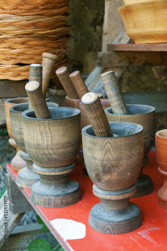 Handmade wooden mortars and pestles on a market stall