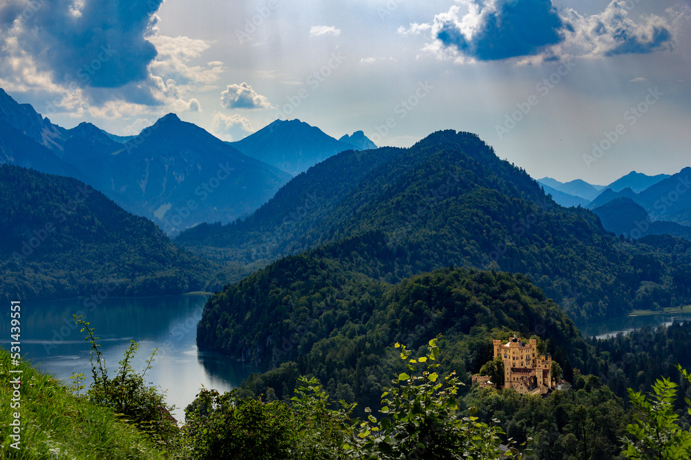Mountain landscape with lakes and castle in Bavaria Germany during summer