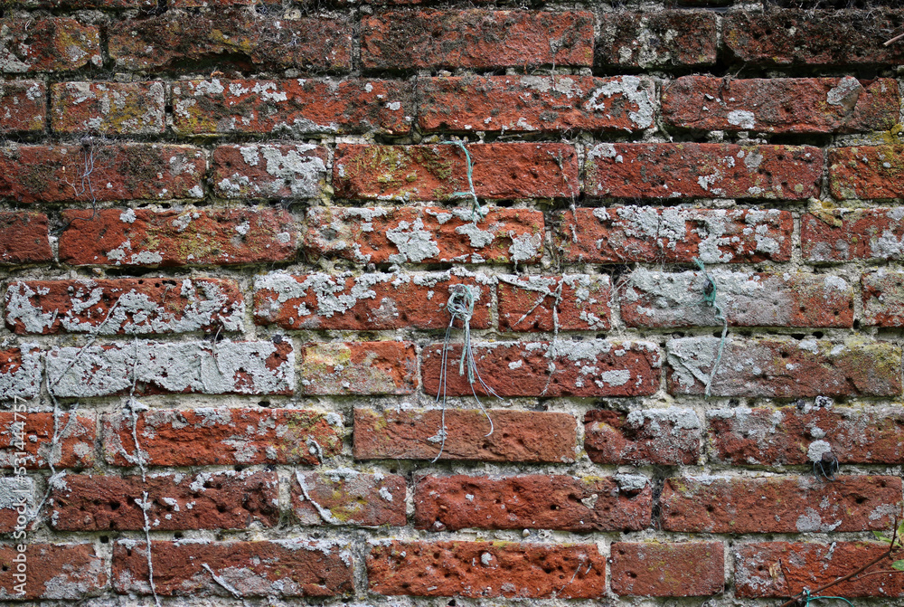 Naklejka premium Old red brick wall in close up