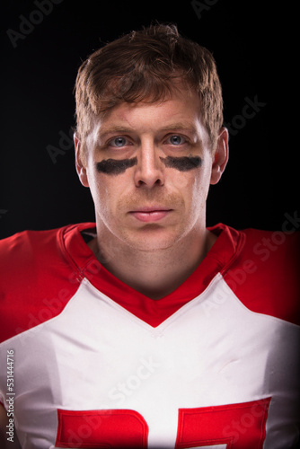 Male American football player with no helmet. photo