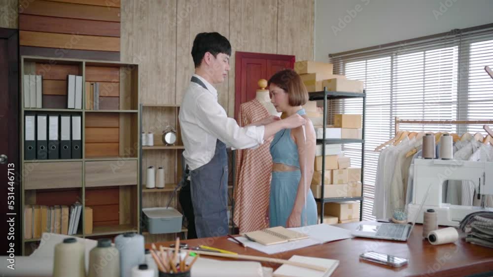 Selective focus Young asian man use body measurement tape beautiful customer woman. Female client and tailor taking measurements with tape measures for sew clothes. Professional fashion designer.
Selective focus Young asian man use body measurement tape beautiful customer woman. Female client and tailor taking measurements with tape measures for sew clothes. Professional fashion designer.