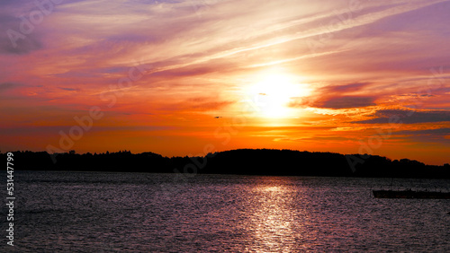 sunset over the lake © adam