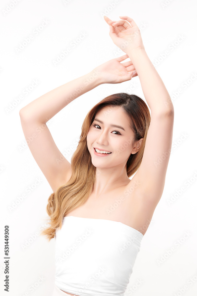 Beautiful Young Asian woman lifting hands up to show off clean and hygienic armpits or underarms on white background, Smooth armpit cleanliness and protection concept Beautiful Young Asian woman lifting hands up to show off clean and hygienic armpits or underarms on white background, Smooth armpit cleanliness and protection concept