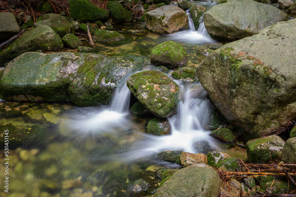 Mountain stream with stones with clear water Mountain stream with stones with clear water