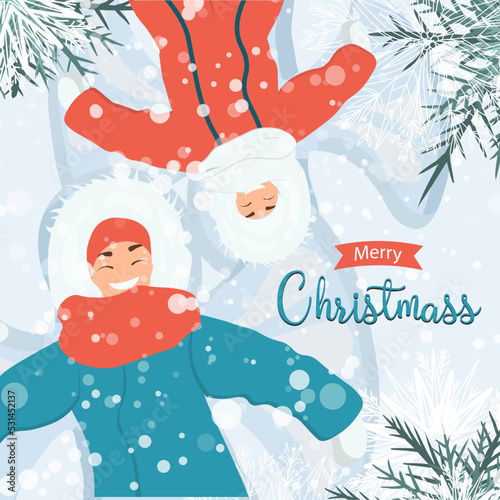 A woman and a child lie on the snow.Games on the street in winter. Winter activity. Snowing. Merry Christmas