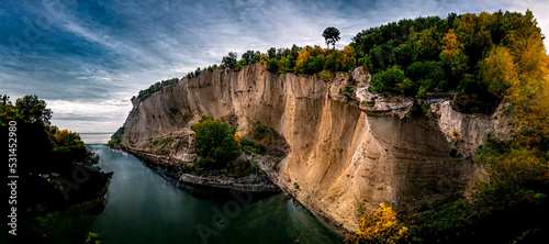 3D illustration. Beautiful cliff with river and trees with dramatic sky design background