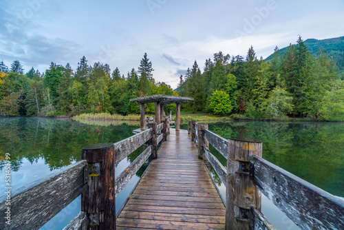 Fototapeta Naklejka Na Ścianę i Meble -  Day lodge with a dock, amazing lakefront views. Fall colors in the Silver Lake Campground, Fall Time, North Cascades Region