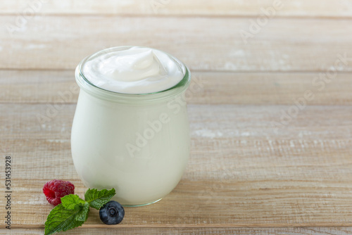 fresh greek yogurt in glass jar
