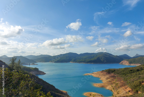 Hiking at the East Dam of High Island Reservoir on Summer. A part of the Hong Kong UNESCO Global Geopark. photo