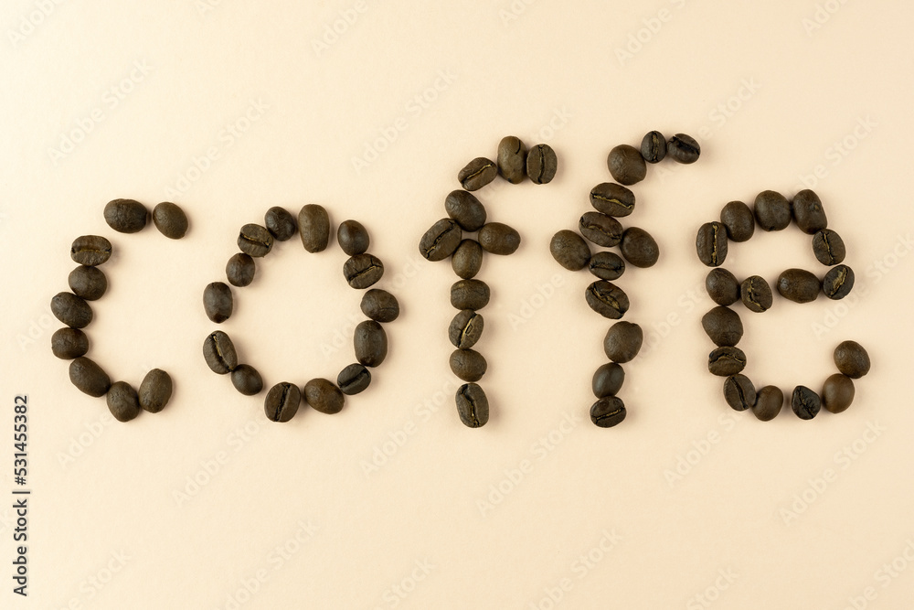 The word coffee is laid out from a grain of black coffee, with a place for the inscription. The word coffee is laid out from a grain of black coffee, with a place for the inscription.