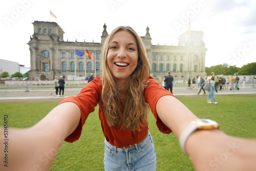Sticker Self portrait of nice excited school exchange girl visiting Europe within the ex