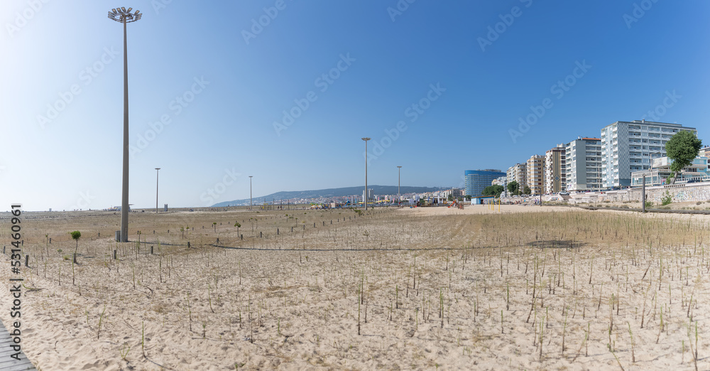 Amazing panoramic view of Figueira da Foz, Claridade beach with pedestrian walkways and main Brazil avenue, along the seafront with buildings