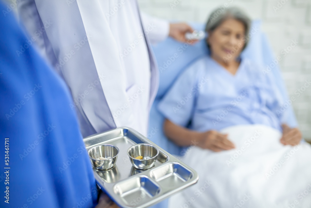 Asian nurses are giving medicine to senior patient at recover room in hospital, Healthcare and medicine concept. Asian nurses are giving medicine to senior patient at recover room in hospital, Healthcare and medicine concept.