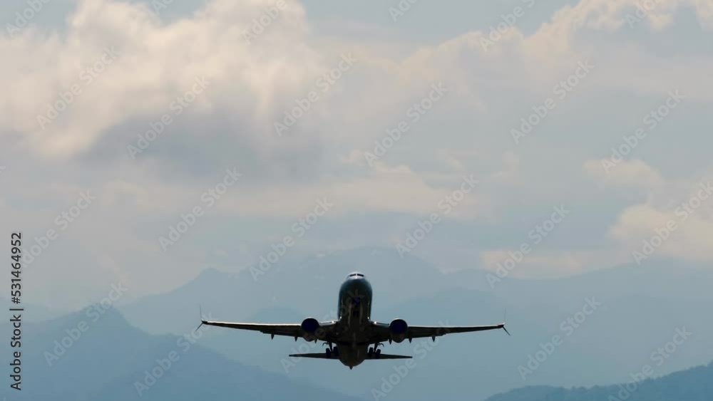 Departing silhouette of large passenger airplane, airliner is taking off, gaining altitude and flying in the dramatic cloudy sky. Transportation, dark, mystery, gloomy and flight concept Departing silhouette of large passenger airplane, airliner is taking off, gaining altitude and flying in the dramatic cloudy sky. Transportation, dark, mystery, gloomy and flight concept