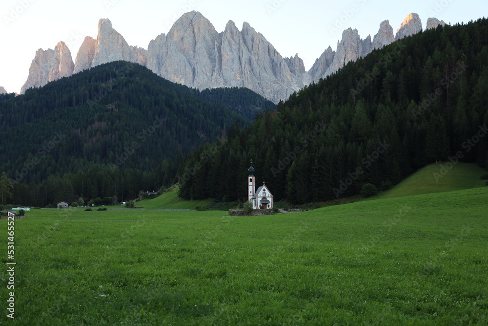 hiker in the mountains,church in the mountains, San Giovanni in Ranui, Alto Adige