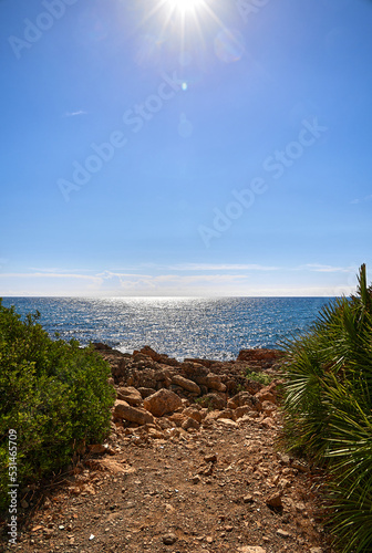 Path to the coastline at the Sierra de Irta national park in Castellon, Spain, on a sunny day in summer