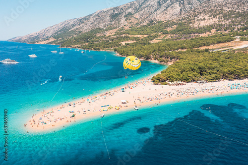 Parasailing over the Adriatic Sea near the island of Brac, Croatia.
