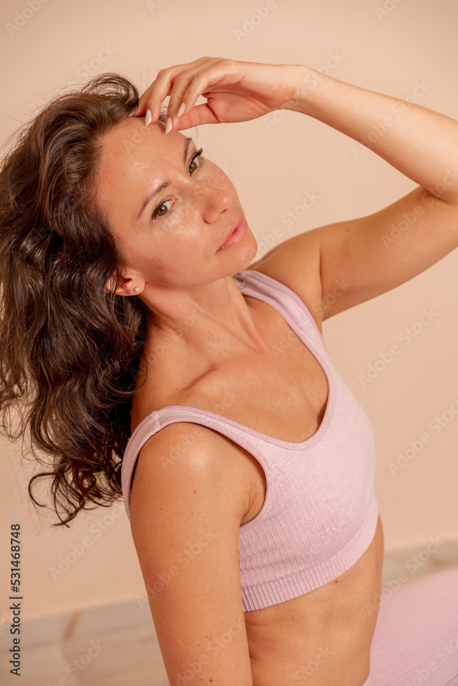 Portrait of a woman in a sporty lilac top Portrait of a woman in a sporty lilac top