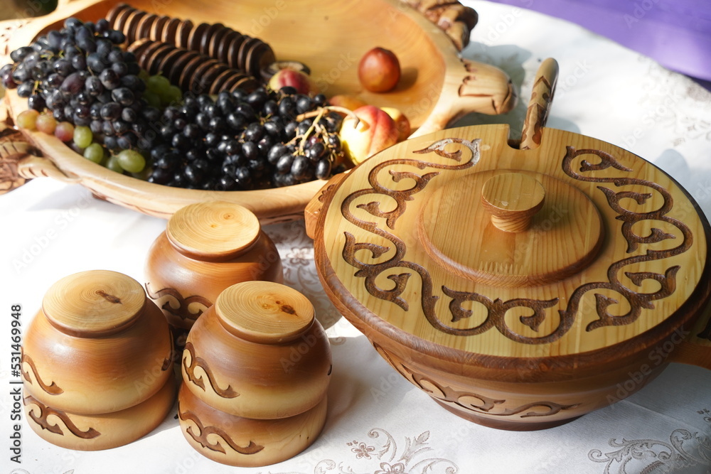 Wooden carved tableware with Kazakh national pattern Wooden carved tableware with Kazakh national pattern