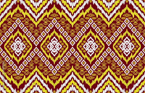 Ornate golden silver ikat patterns on brown background. Geometric tribal vintage retro style. Ethnic fabric ikat seamless pattern. Indian navajo folk ikat vector. Design for texture fabric textile.