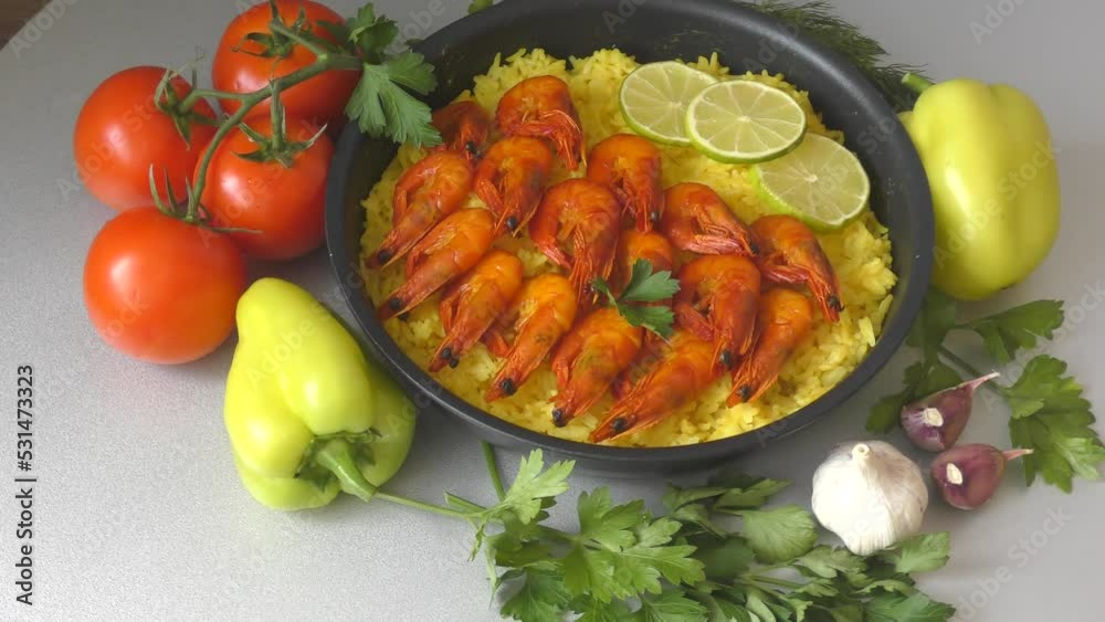 Video „Paella with shrimp is a national Spanish and Valencian dish made