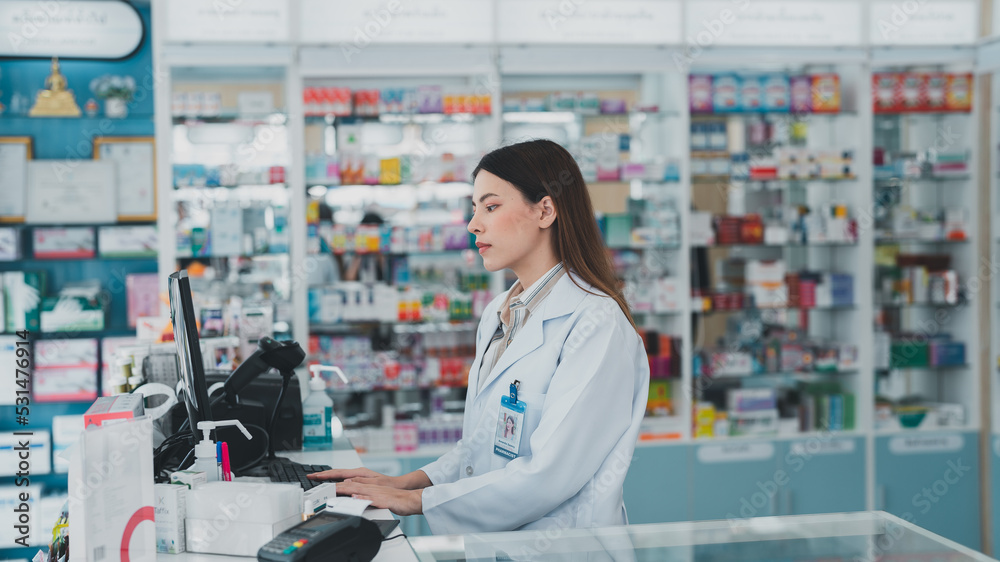 female pharmacist at drugstore.Doctors specializing in medicines.Medical product inventory.female doctor holding a prescription.Health care pharmacists work at the hospital.