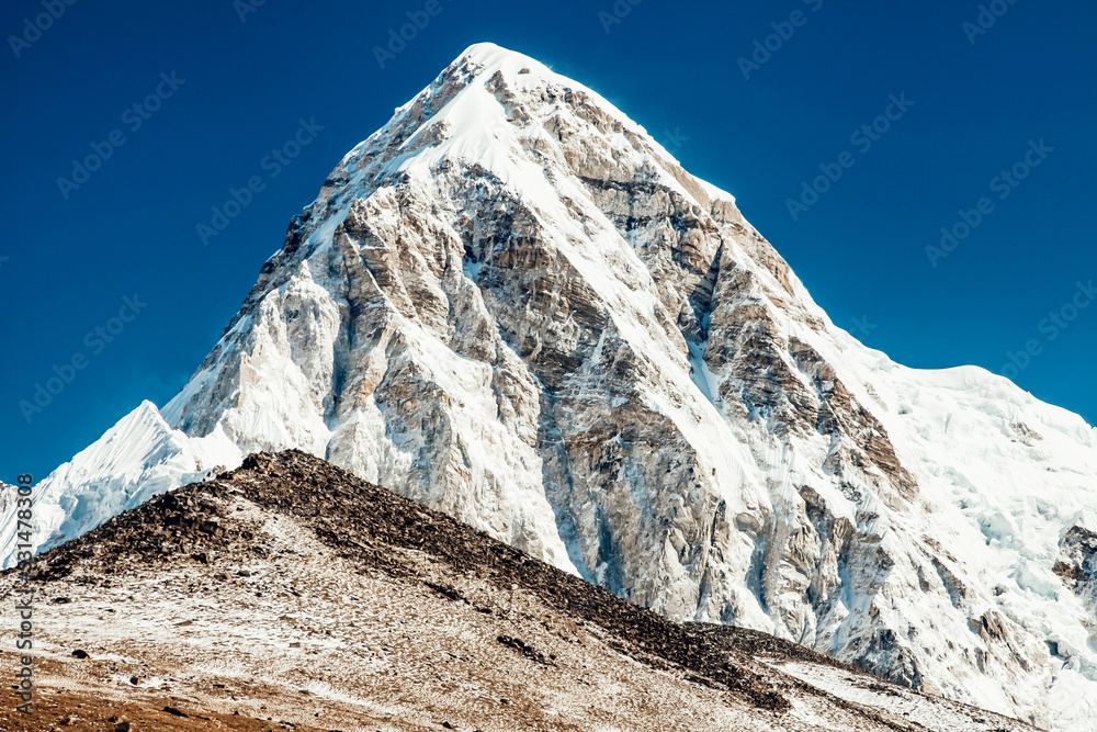Pumori and Kala Patthar mountain summits on the Everest Base Camp trek in Himalayas. Nepal.