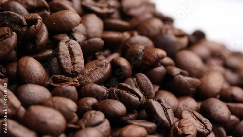 Coffee beans close up. Rotation of roasted coffee beans close-up.