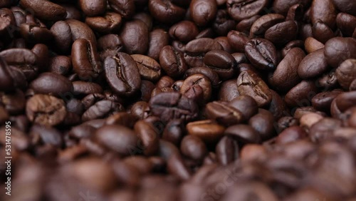 Coffee beans close up. Rotation of roasted coffee beans close-up.
