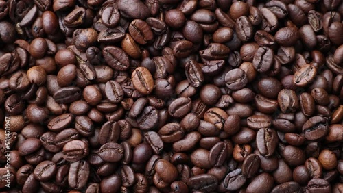 Coffee beans close up. Rotation of roasted coffee beans close-up.