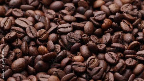 Coffee beans close up. Rotation of roasted coffee beans close-up.