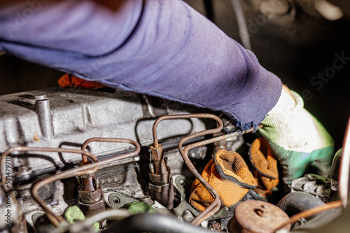 maintenance of injectors and glow plugs of a diesel engine. photo