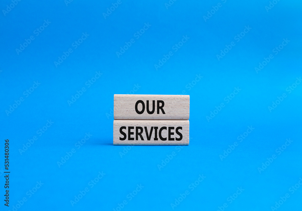 Our services symbol. Concept words Our services on wooden blocks. Beautiful blue background. Business and Our services concept. Copy space.