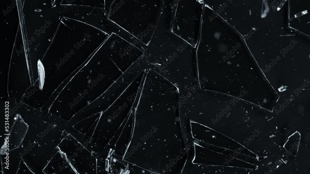 Super Slow Motion Shot of Breaking Real Glass at 1000 fps. Isolated on Black Background.