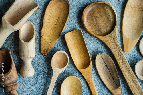 Overhead view of assorted wooden spoons and kitchen cooking utensils photo