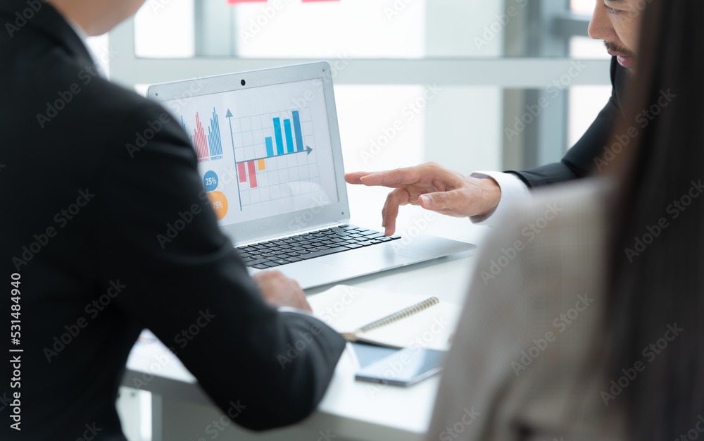 A group of young Asian entrepreneurs. Top Management is meeting to review stock investment data from the team in a meeting room with natural light A group of young Asian entrepreneurs. Top Management is meeting to review stock investment data from the team in a meeting room with natural light