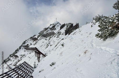 Avalanche barriers on the way to the Mattstogg Mattstock summit above Amden. Freshly snowed mountain peak. Swiss Alps. High quality photo photo