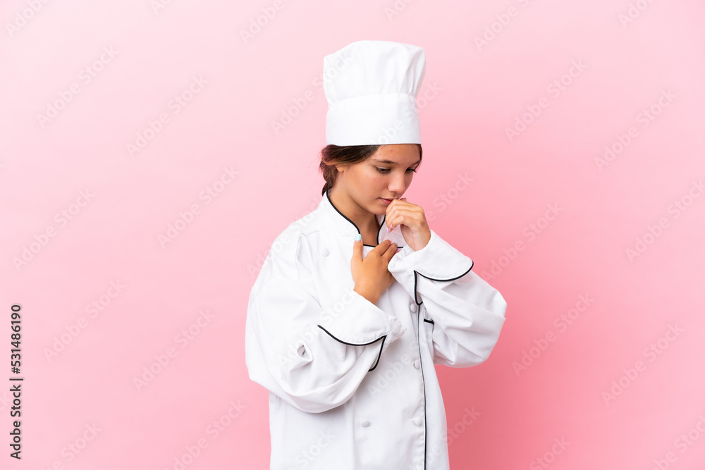 Little caucasian chef girl isolated on pink background is suffering with cough and feeling bad Little caucasian chef girl isolated on pink background is suffering with cough and feeling bad