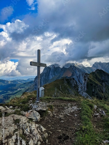 hike to the lutispitz in the alpstein canton of St. Gallen. View of the Santis with the summit cross. wanderlust. High quality photo